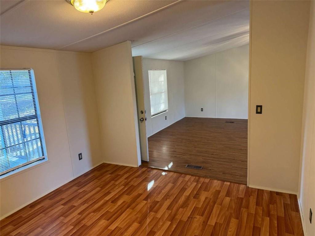 4044 Friendship Road Buford, GA 30519 - Photo 12 of 30 a view of empty room with wooden floor and fan