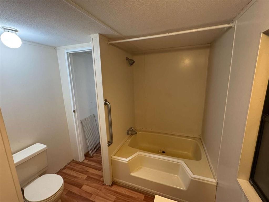 4044 Friendship Road Buford, GA 30519 - Photo 21 of 30 a bathroom with a tub and shower