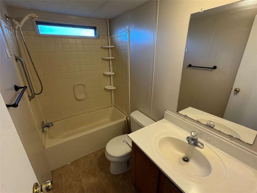 4044 Friendship Road Buford, GA 30519 - Photo 23 of 30 a bathroom with a sink toilet and shower