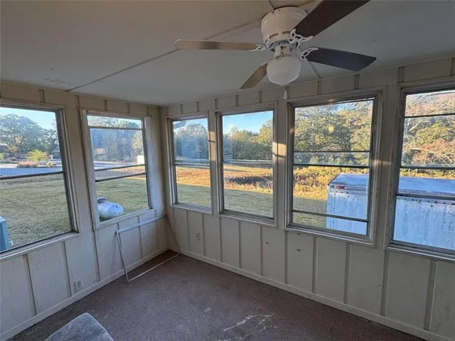 a view of an entryway with a floor to ceiling window