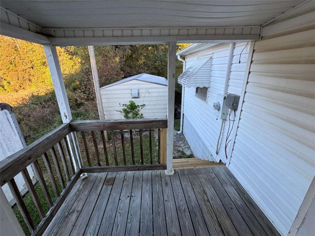 4044 Friendship Road Buford, GA 30519 - Photo 27 of 30 a view of deck with wooden floor and fence