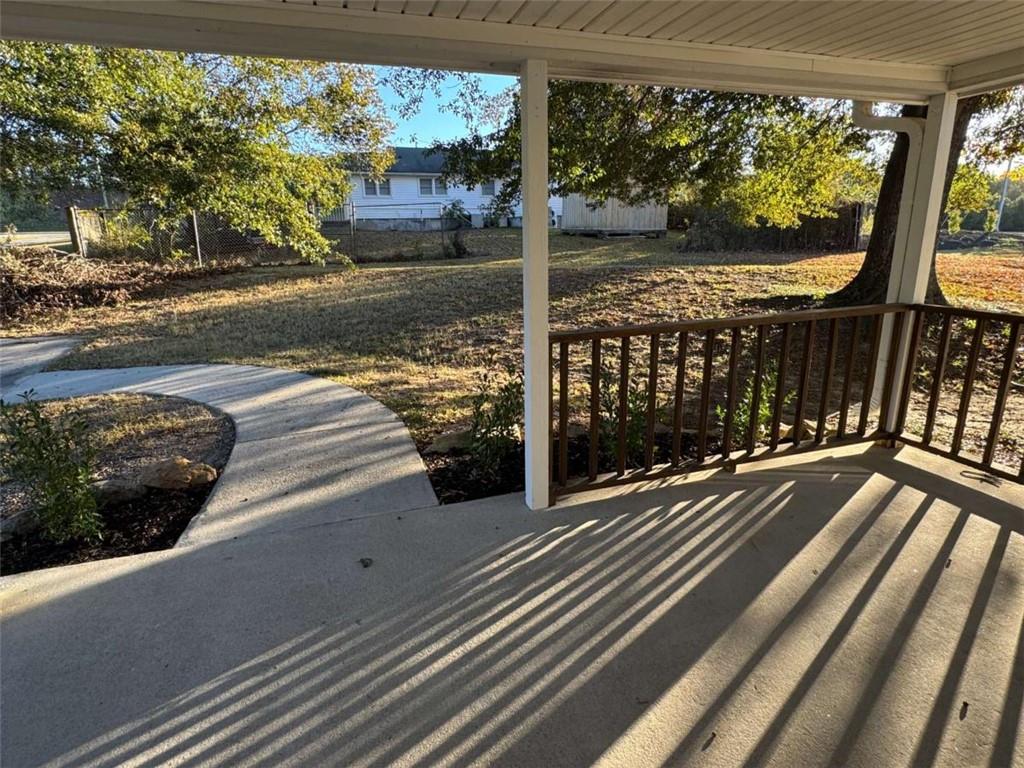 4044 Friendship Road Buford, GA 30519 - Photo 28 of 30 a view of a balcony with floor to ceiling windows wooden floor