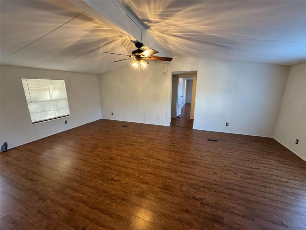 4044 Friendship Road Buford, GA 30519 - Photo 4 of 30 an empty room with wooden floor and windows