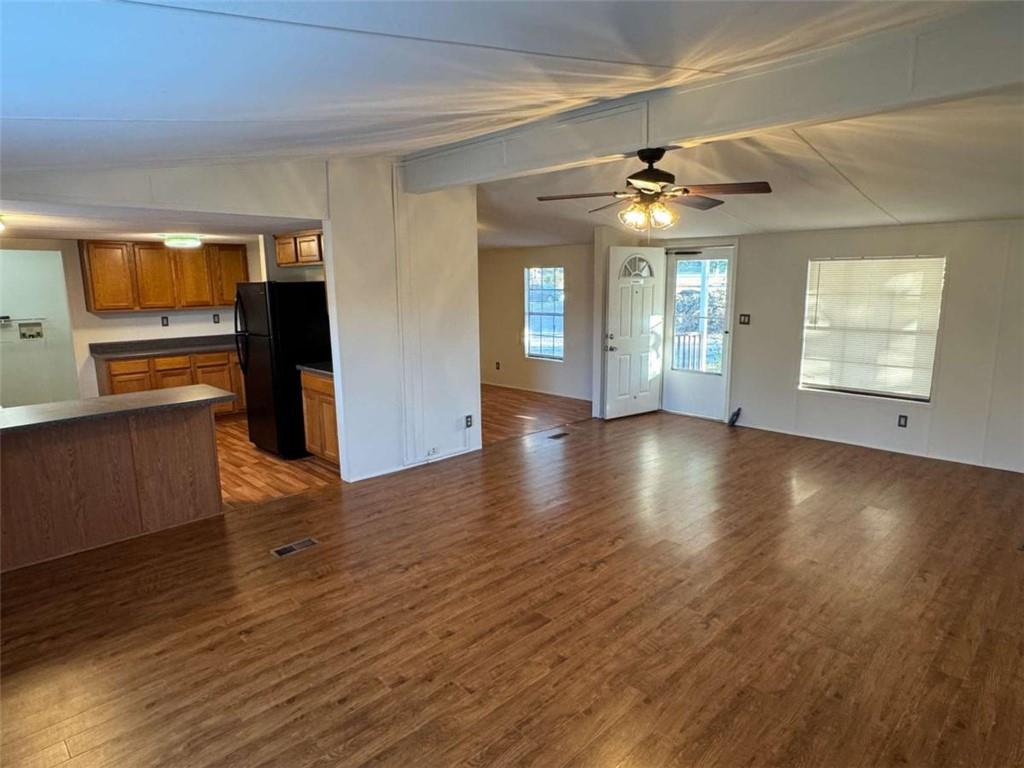 4044 Friendship Road Buford, GA 30519 - Photo 10 of 30 a view of an empty room with window and wooden floor