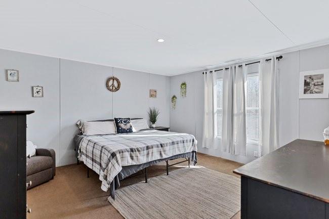 104 Private Road 1114 Decatur, TX 76234 - Photo 12 of 39 a bedroom with a bed and a cabinets