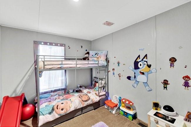 104 Private Road 1114 Decatur, TX 76234 - Photo 18 of 39 a bedroom with a bed and a window