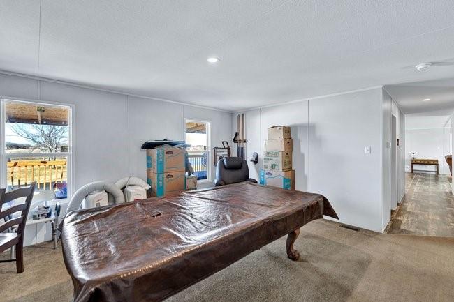 104 Private Road 1114 Decatur, TX 76234 - Photo 22 of 39 a living room with furniture and a table