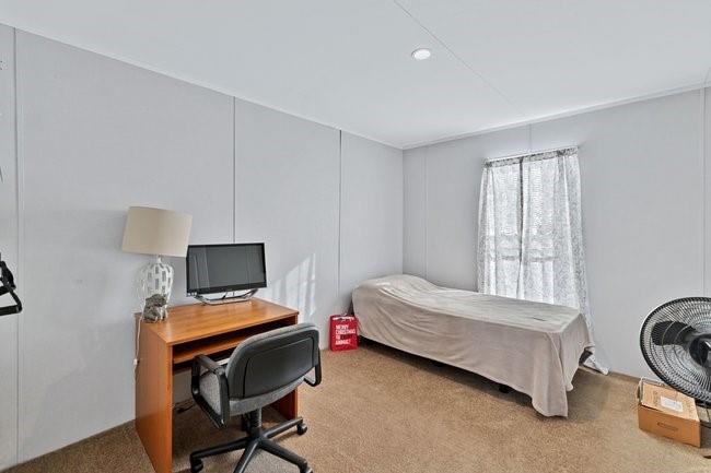 104 Private Road 1114 Decatur, TX 76234 - Photo 23 of 39 a bedroom with a bed chair and a window
