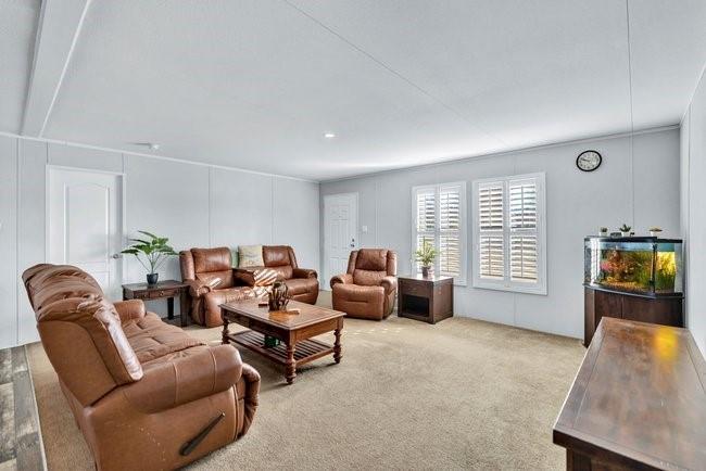 104 Private Road 1114 Decatur, TX 76234 - Photo 5 of 39 a living room with furniture and a flat screen tv