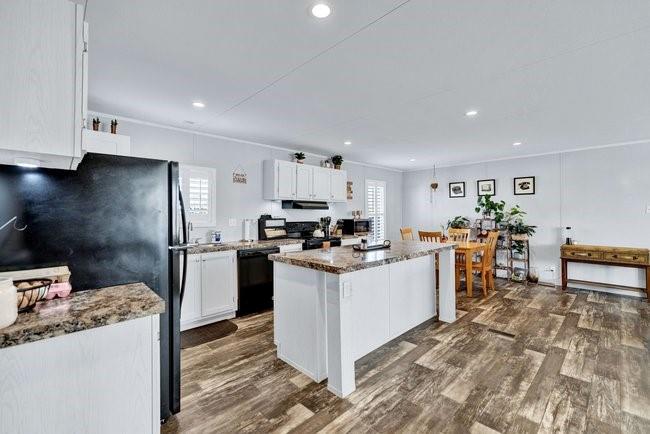104 Private Road 1114 Decatur, TX 76234 - Photo 9 of 39 a kitchen with a sink cabinets and stainless steel appliances