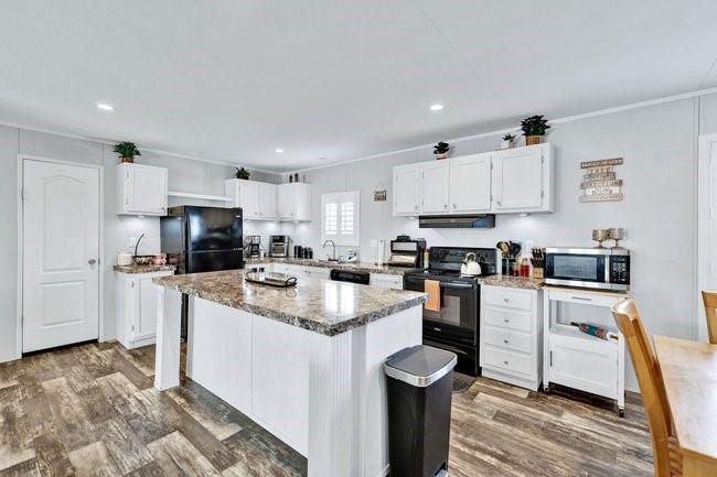 104 Private Road 1114 Decatur, TX 76234 - Photo 10 of 39 a kitchen with cabinets and stainless steel appliances