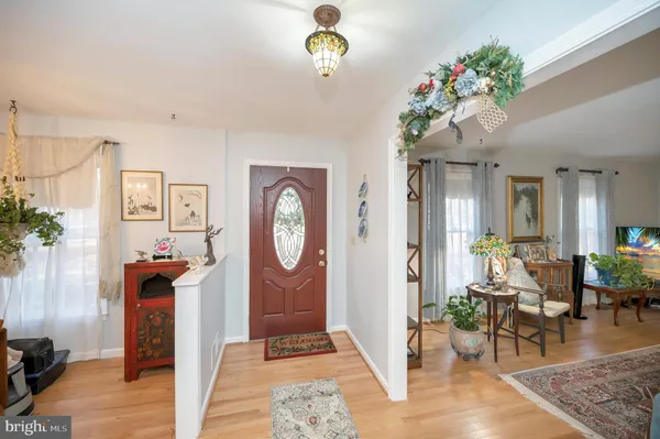 a living room with furniture a window and a chandelier