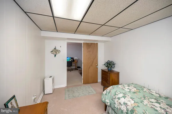 a bedroom with a bed and a table