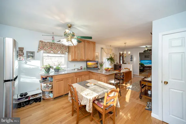 a very nice looking dining room with a table and chairs in it