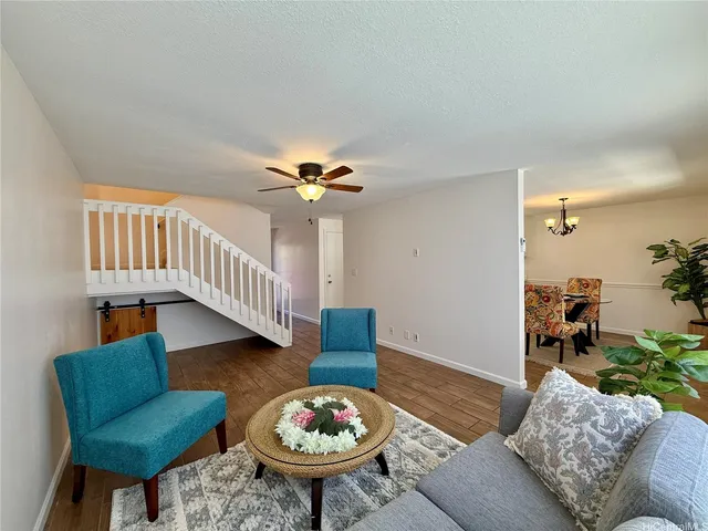 a living room with furniture and a table