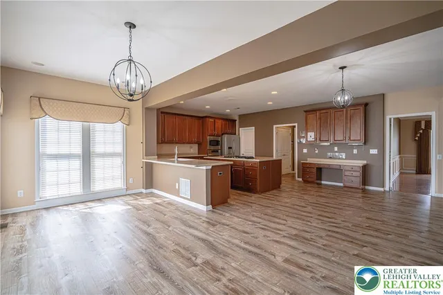 a view of entryway with wooden floor and stairs