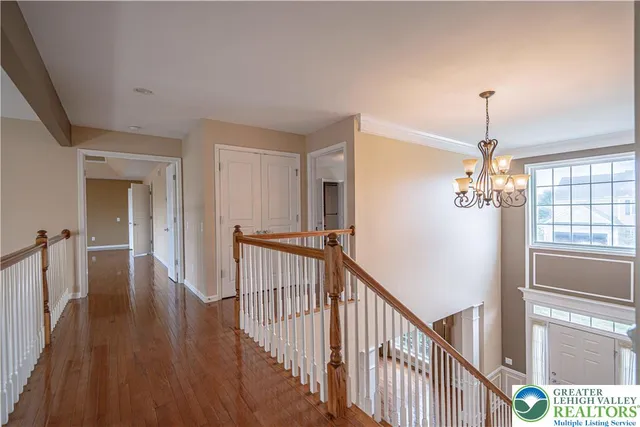 a spacious bathroom with a granite countertop double vanity sink and a mirror