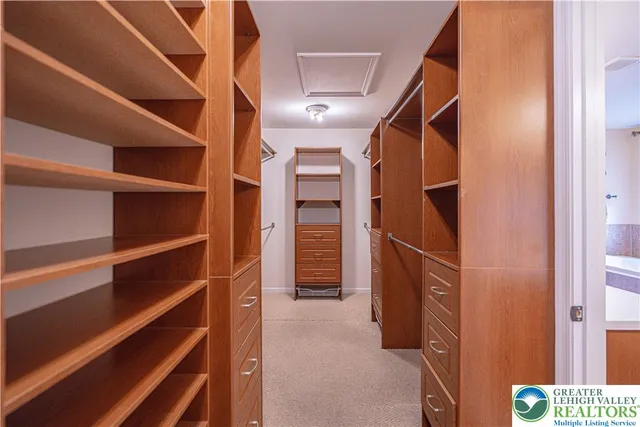 a bathroom with a granite countertop sink a toilet a mirror and shower