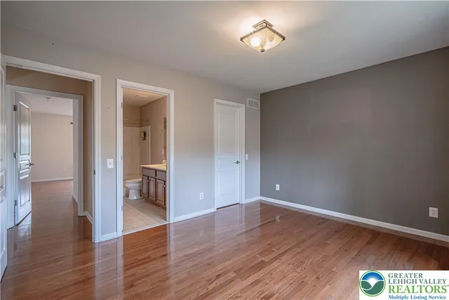 a view of an empty room with furniture