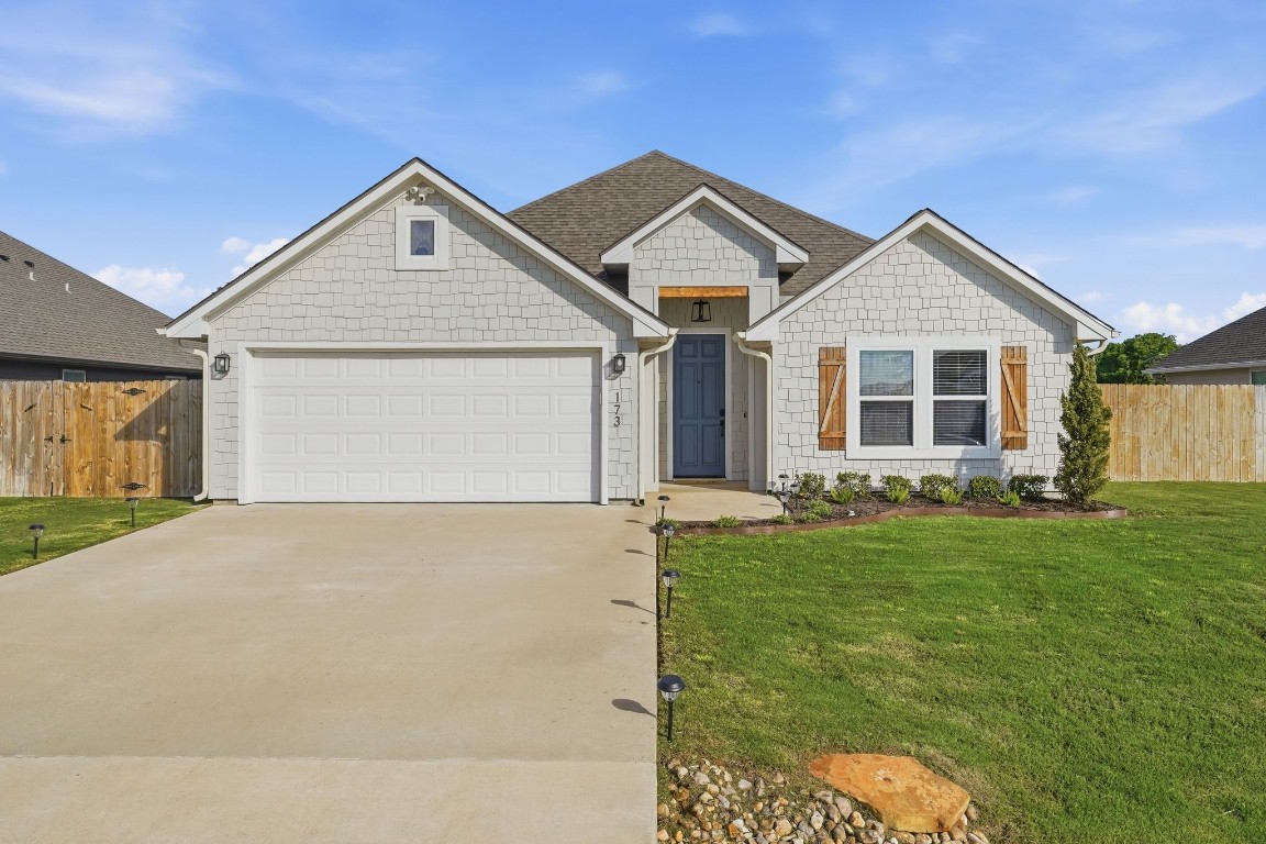 173 Brazos Bend Snook, TX 77879 - Photo 1 of 41 a front view of a house with a yard
