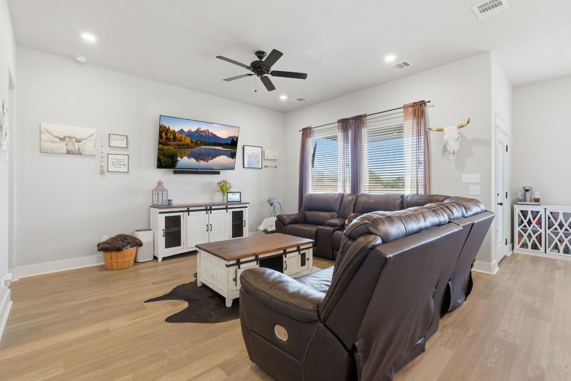 173 Brazos Bend Snook, TX 77879 - Photo 12 of 41 a living room with furniture and a flat screen tv