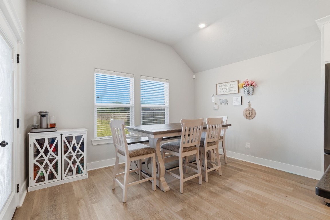 173 Brazos Bend Snook, TX 77879 - Photo 19 of 41 a dining room with furniture and wooden floor