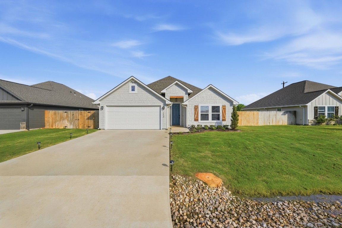 173 Brazos Bend Snook, TX 77879 - Photo 2 of 41 a front view of a house with a yard