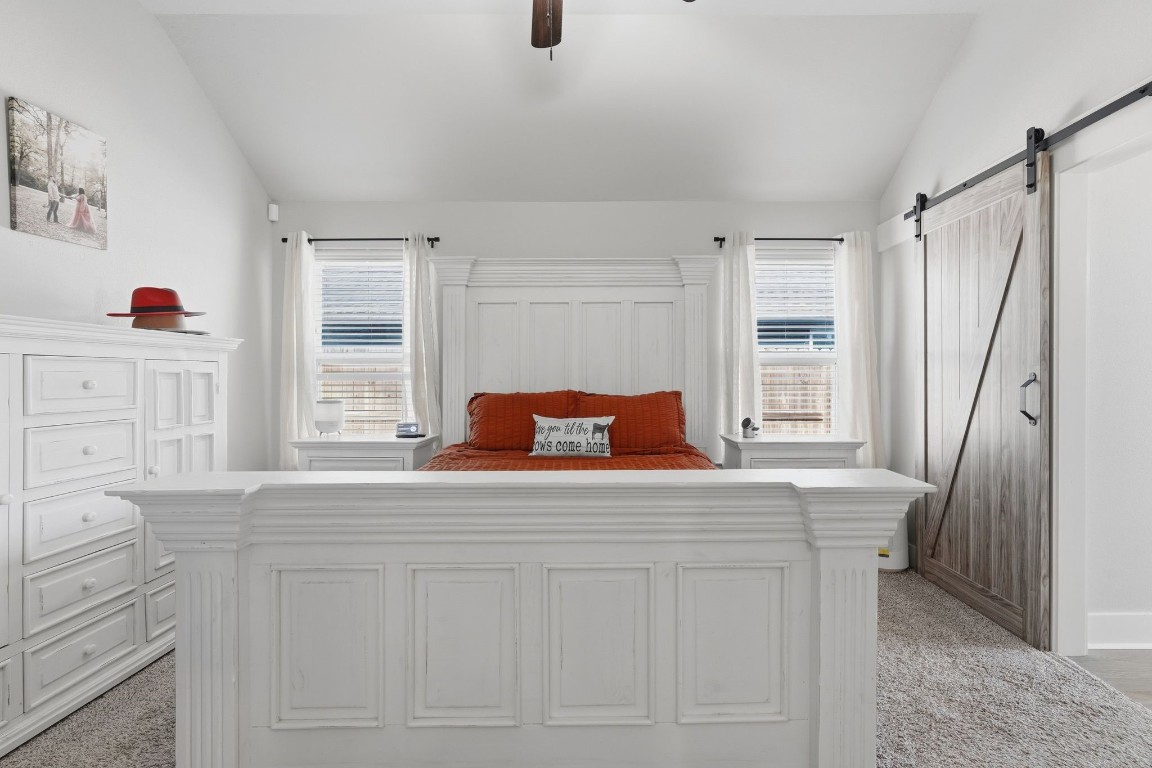 173 Brazos Bend Snook, TX 77879 - Photo 22 of 41 a bedroom with a bed and a window