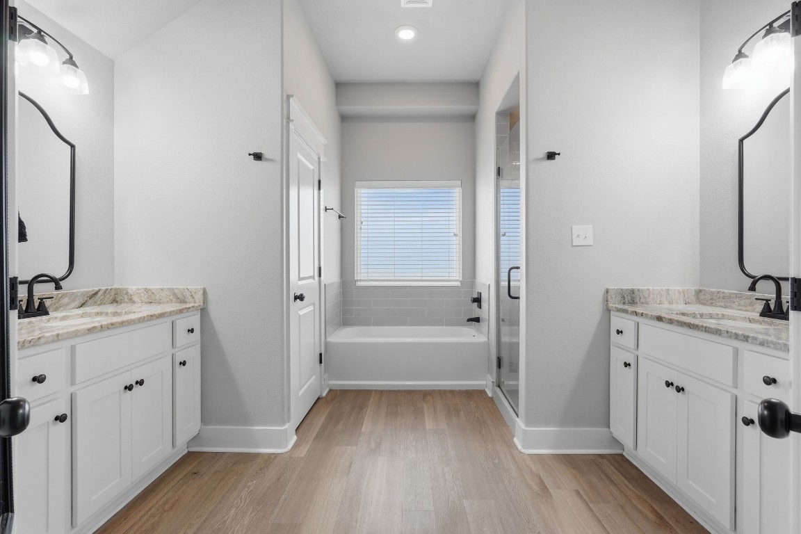 173 Brazos Bend Snook, TX 77879 - Photo 24 of 41 a bathroom with a sink a mirror and a shower
