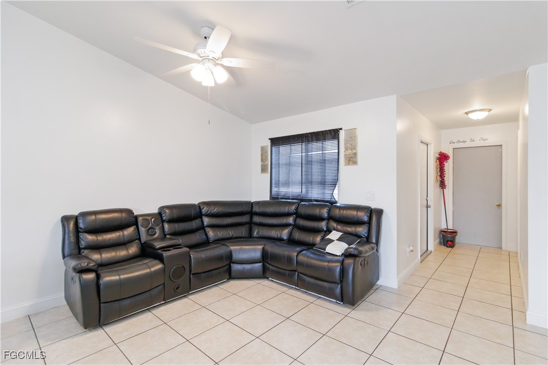 776-778 Alabama Road South Lehigh Acres, FL 33974 - Photo 11 of 50 a living room with furniture and a chandelier