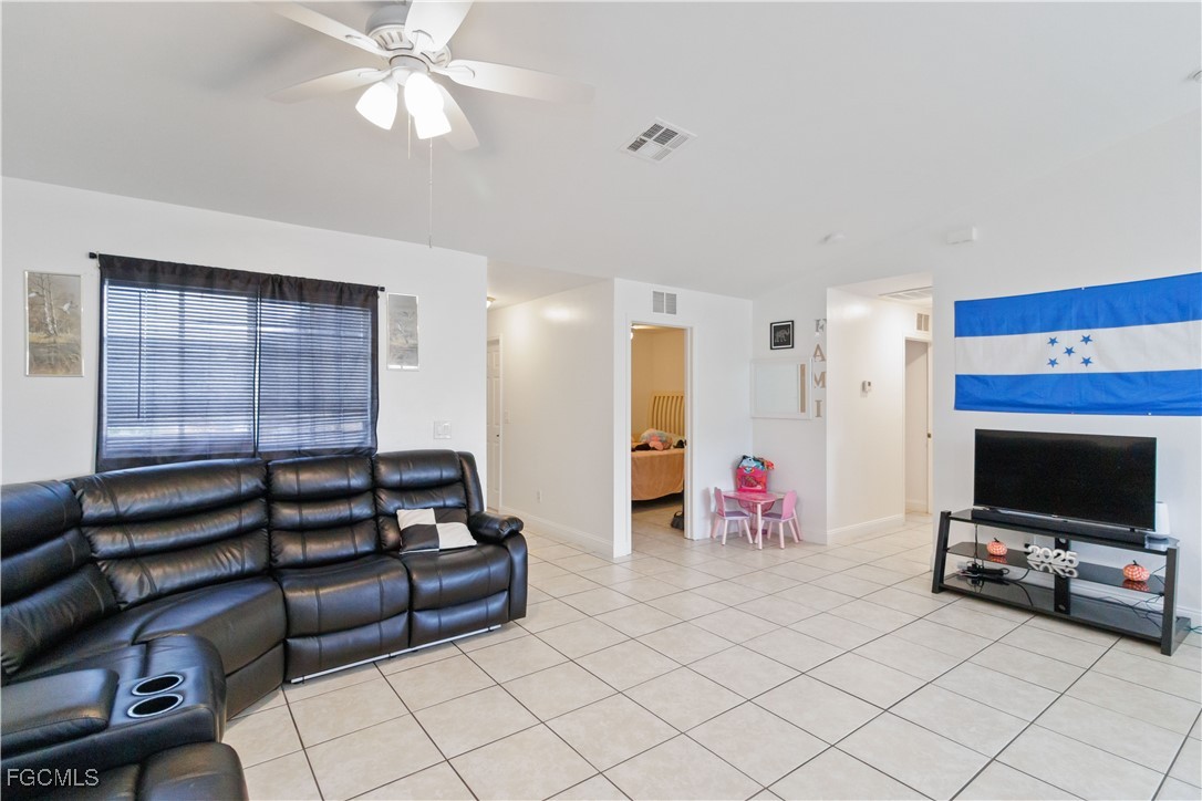 776-778 Alabama Road South Lehigh Acres, FL 33974 - Photo 12 of 50 a living room with furniture and a flat screen tv