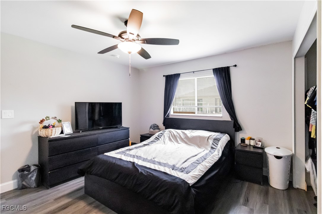 776-778 Alabama Road South Lehigh Acres, FL 33974 - Photo 24 of 50 a bedroom with a bed and a flat screen tv