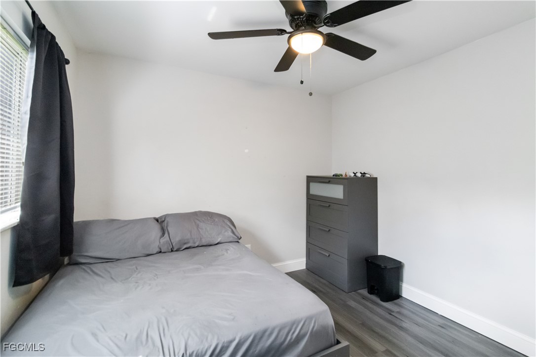 776-778 Alabama Road South Lehigh Acres, FL 33974 - Photo 26 of 50 a bedroom with a bed and a ceiling fan