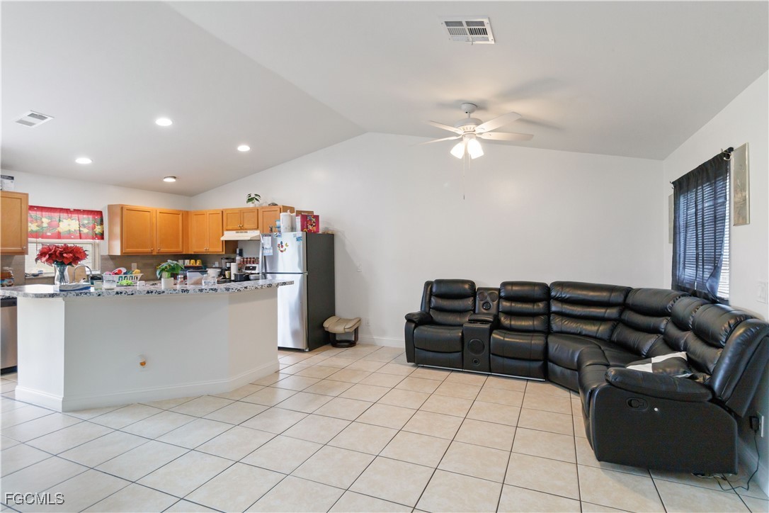 776-778 Alabama Road South Lehigh Acres, FL 33974 - Photo 3 of 50 a living room with furniture and kitchen view