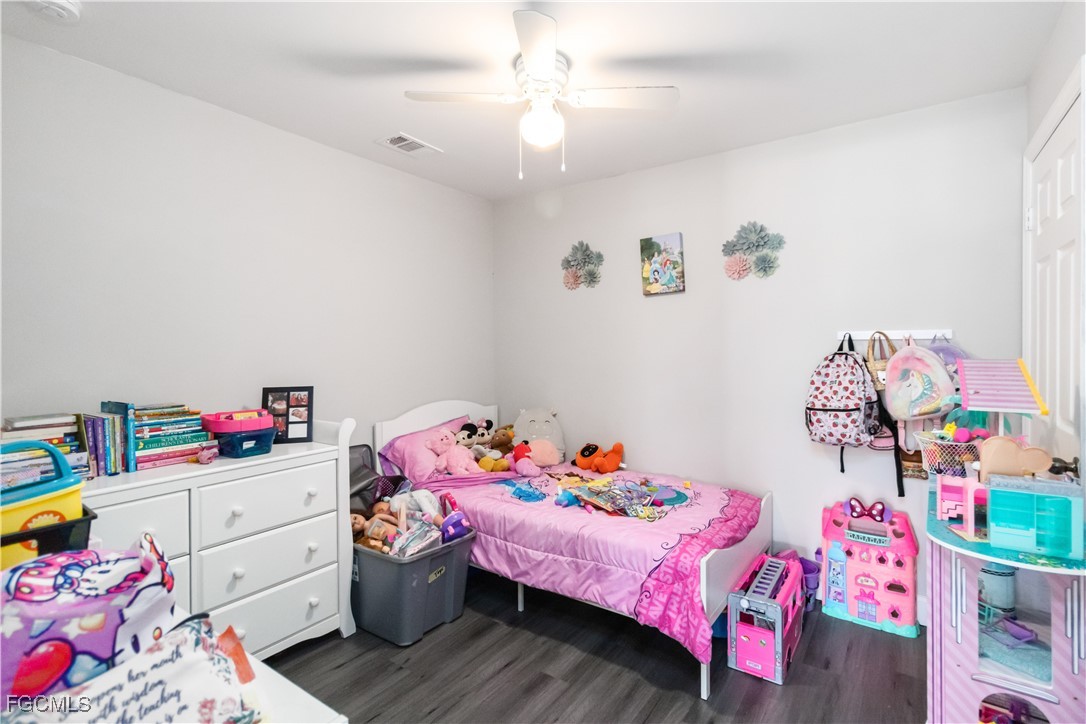 776-778 Alabama Road South Lehigh Acres, FL 33974 - Photo 31 of 50 a bedroom with a bed and wooden floor