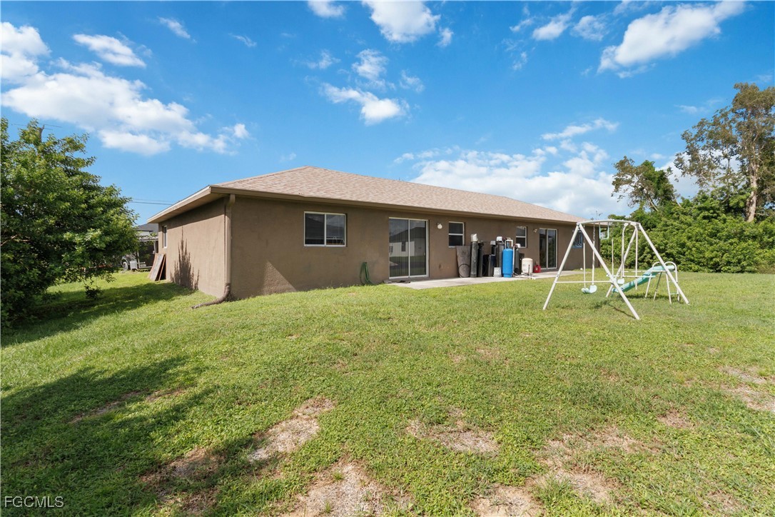 776-778 Alabama Road South Lehigh Acres, FL 33974 - Photo 35 of 50 a view of a house with a backyard
