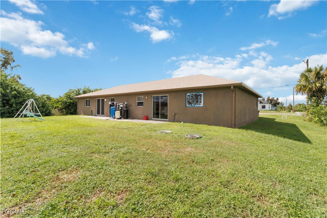 776-778 Alabama Road South Lehigh Acres, FL 33974 - Photo 37 of 50 a front view of house with yard and green space