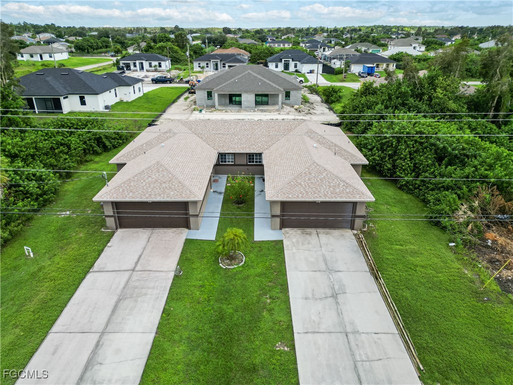 776-778 Alabama Road South Lehigh Acres, FL 33974 - Photo 40 of 50 a aerial view of a house with a yard
