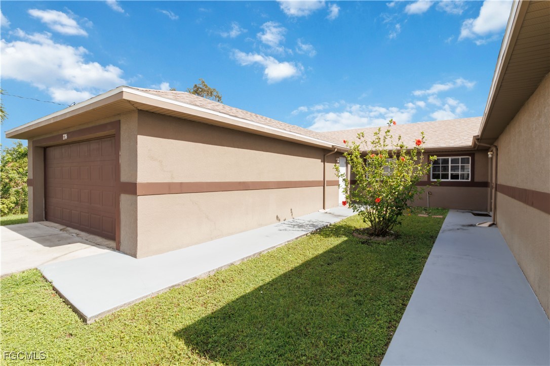 776-778 Alabama Road South Lehigh Acres, FL 33974 - Photo 44 of 50 a view of a back yard of the house