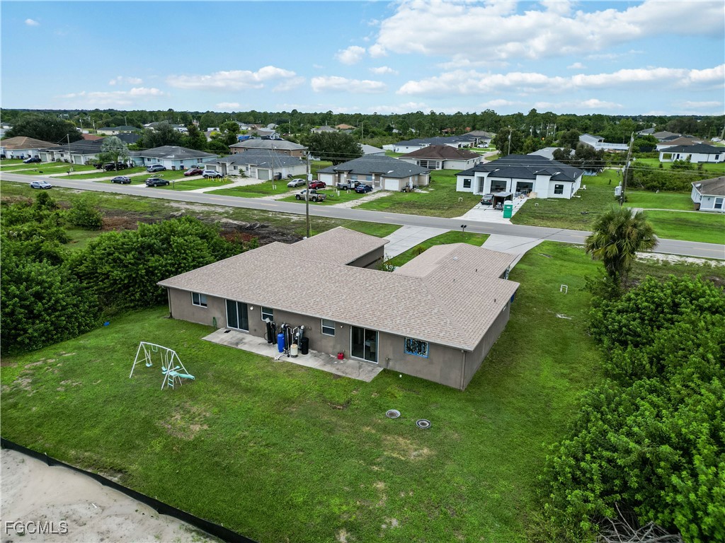 776-778 Alabama Road South Lehigh Acres, FL 33974 - Photo 47 of 50 a view of a house with a big yard