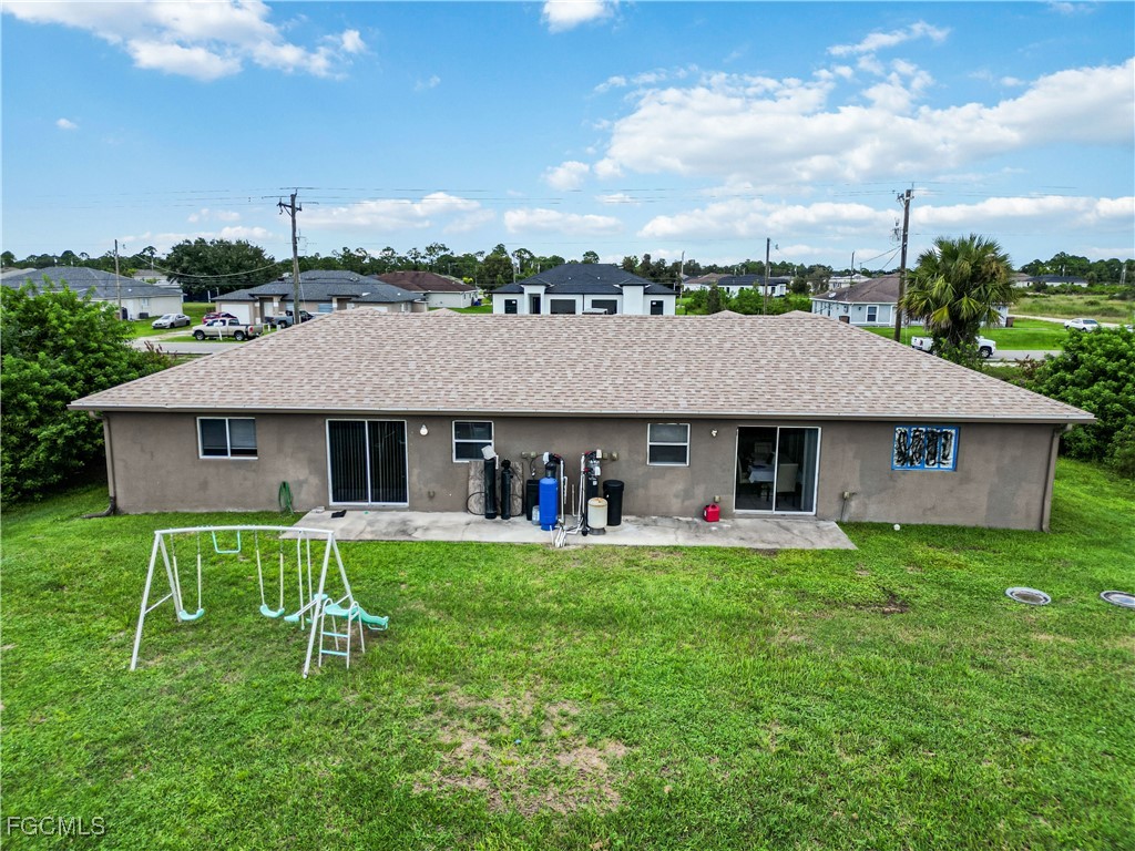 776-778 Alabama Road South Lehigh Acres, FL 33974 - Photo 48 of 50 a view of a house with a yard and sitting area