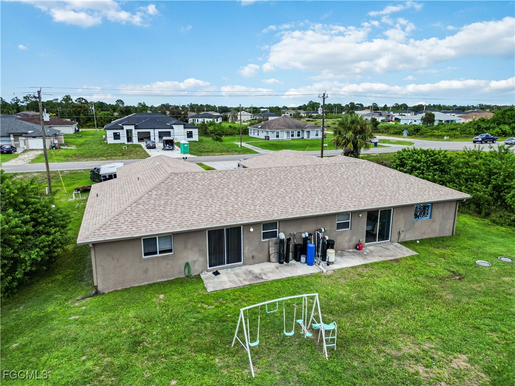 776-778 Alabama Road South Lehigh Acres, FL 33974 - Photo 49 of 50 an aerial view of a house with a yard table and chairs
