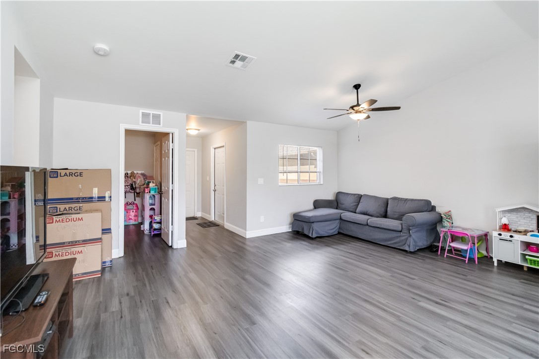 776-778 Alabama Road South Lehigh Acres, FL 33974 - Photo 7 of 50 a living room with furniture and a wooden floor