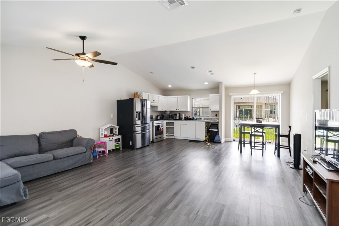 776-778 Alabama Road South Lehigh Acres, FL 33974 - Photo 8 of 50 a living room with furniture and kitchen view