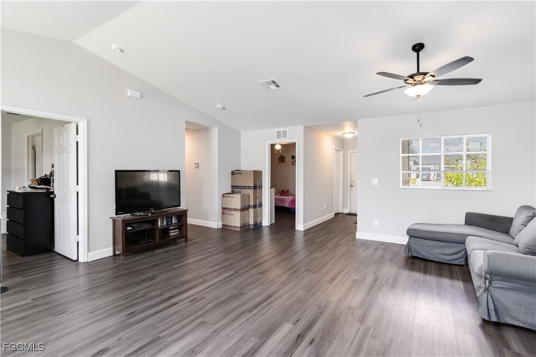 776-778 Alabama Road South Lehigh Acres, FL 33974 - Photo 10 of 50 a living room with furniture and a flat screen tv