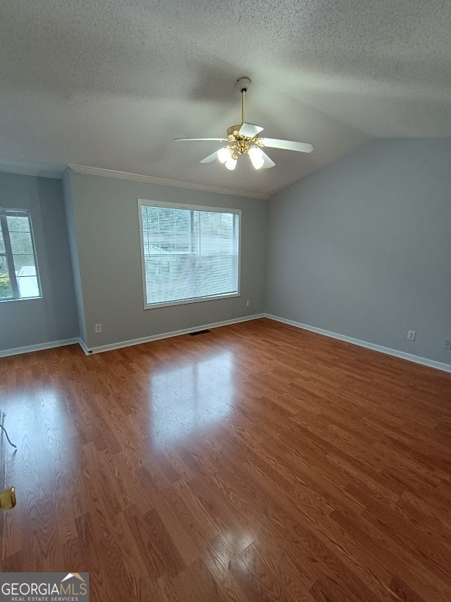 7355 Drake Avenue Lithonia, GA 30058 - Photo 11 of 20 a view of an empty room with wooden floor and a window