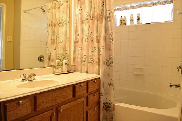 a bathroom with a sink and a bathtub