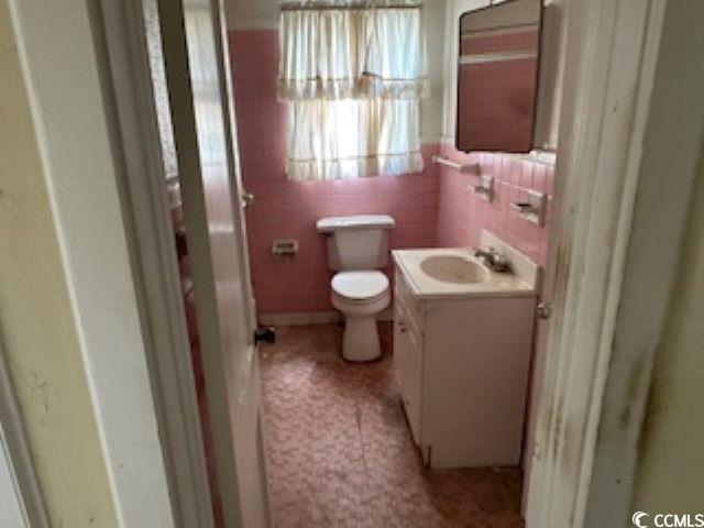 1504 Chester Street Myrtle Beach, SC 29577 - Photo 12 of 15 Half bathroom with toilet and vanity
