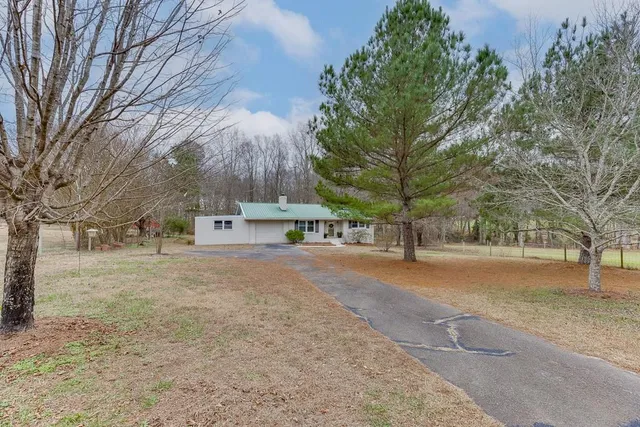 a aerial view of a house with a yard