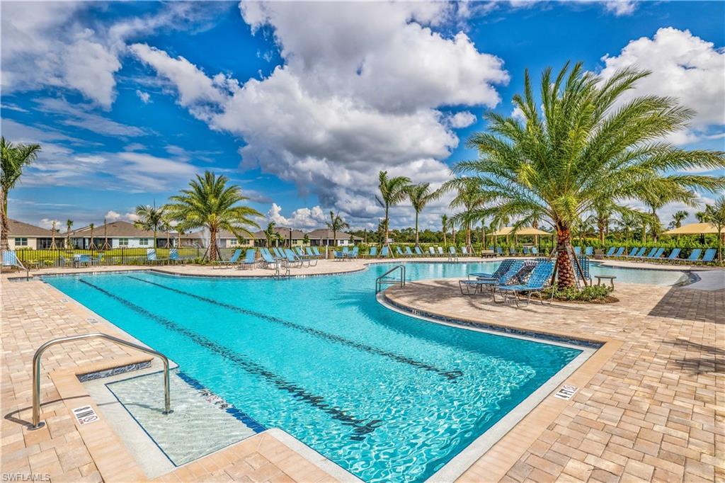 17767 Shade Tree Loop Punta Gorda, FL 33982 - Photo 23 of 35 a view of a swimming pool with an outdoor seating